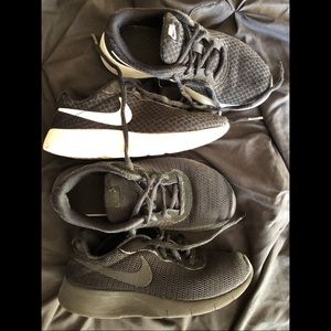 Two pairs of used Nike sneakers